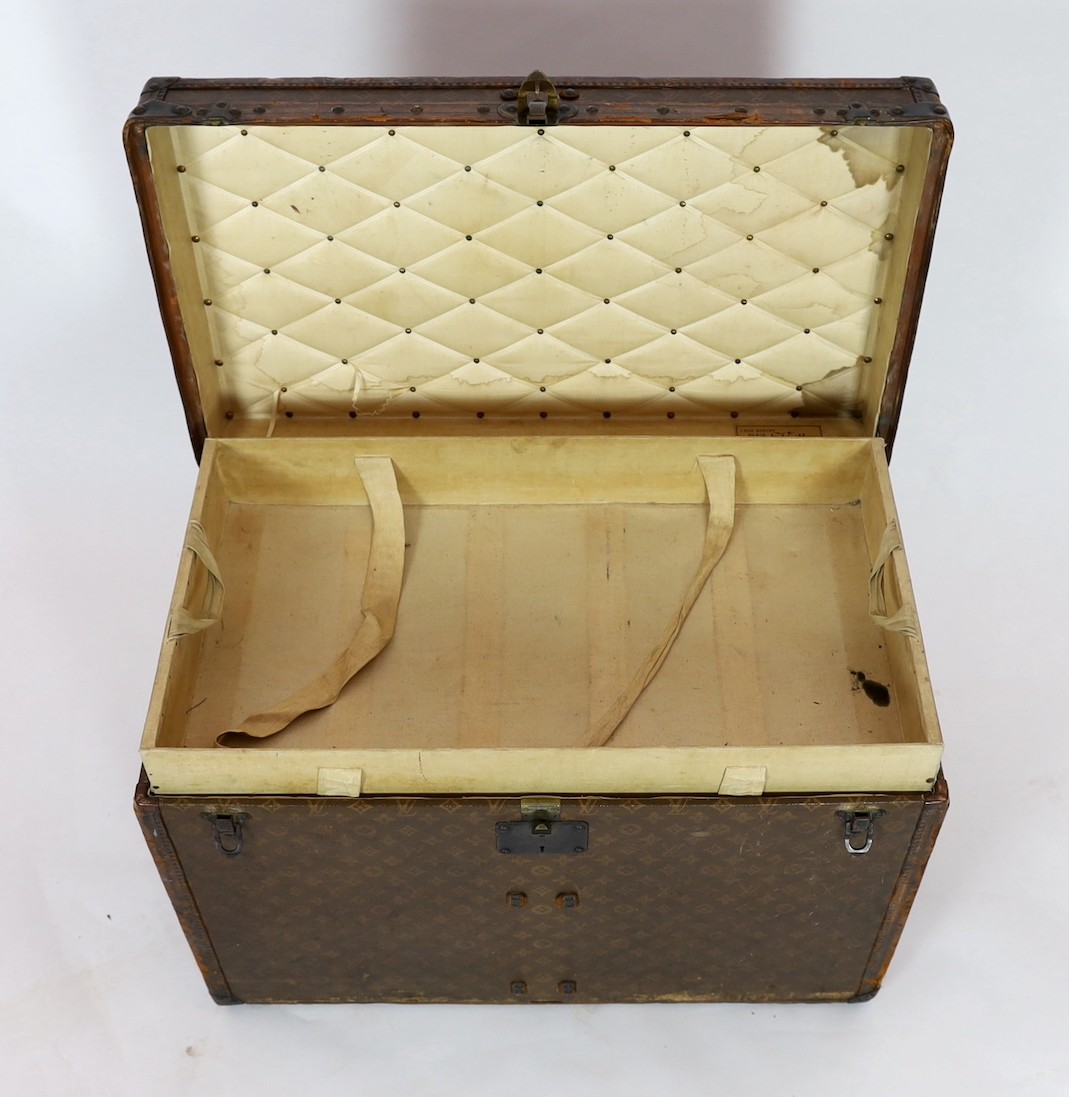 A Louis Vuitton brass mounted leather bound trunk, c.1910, numbered 137426, 75cm wide, 43cm deep, 54cm high